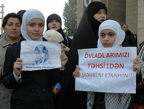 Participants of the rally against the ban to wear hijabs in schools at the Ministry of Education of Azerbaijan. Posters: "Freedom of conscience is sacred" (on the left) and "Don't deprive our kids of education!" (on the right). Baku, December 10, 2010. Photo by Turkhan Karimov Participants of the rally against the ban to wear hijabs in schools at the Ministry of Education of Azerbaijan. Posters: "Freedom of conscience is sacred" (on the left) and "Don't deprive our kids of education!" (on the right). Baku, December 10, 2010. Photo by Turkhan Karimov