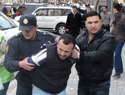 Policemen detaining a protester at the oppositional rally in Baku, April 17, 2011. Courtesy by the "Turan" Information Agency Policemen detaining a protester at the oppositional rally in Baku, April 17, 2011. Courtesy by the "Turan" Information Agency
