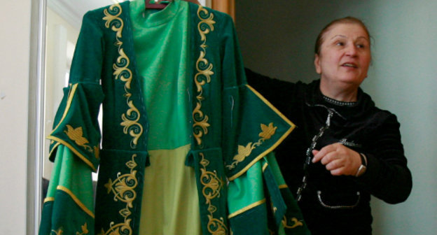 Isolda Gogichaeva, head of a Vladikavkaz sewing enterprise with a female dress. North Ossetia, Vladikavkaz, April 18, 2011. Photo by Kazbek Basaev for the "Caucasian Knot" Isolda Gogichaeva, head of a Vladikavkaz sewing enterprise with a female dress. North Ossetia, Vladikavkaz, April 18, 2011. Photo by Kazbek Basaev for the "Caucasian Knot"
