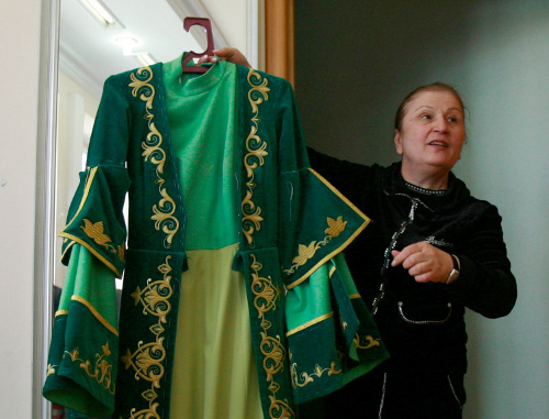 Isolda Gogichaeva, head of a Vladikavkaz sewing enterprise with a female dress. North Ossetia, Vladikavkaz, April 18, 2011. Photo by Kazbek Basaev for the "Caucasian Knot" Isolda Gogichaeva, head of a Vladikavkaz sewing enterprise with a female dress. North Ossetia, Vladikavkaz, April 18, 2011. Photo by Kazbek Basaev for the "Caucasian Knot"