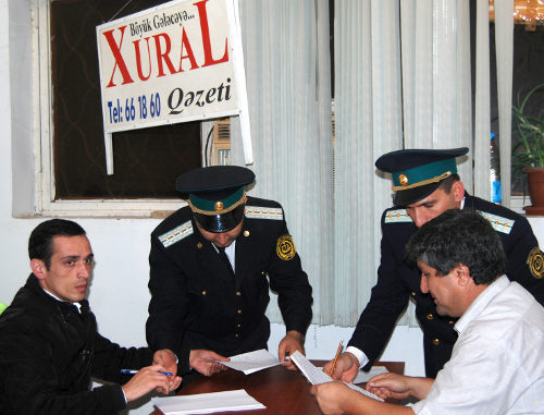 Policemen sequestrate the property of the editorial office of the "Khural" newspaper, Baku, Azerbaijan, October 19, 2011. Photo by the Institute for Reporters' Freedom and Safety (www.irfs.az) Policemen sequestrate the property of the editorial office of the "Khural" newspaper, Baku, Azerbaijan, October 19, 2011. Photo by the Institute for Reporters' Freedom and Safety (www.irfs.az)