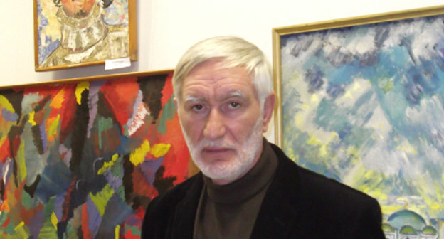 Exhibition of professional and amateur painters "Preodolenie" (Overcoming) within the Arts Festival of Repressed Nations. Daniyal Khadjiev, a corresponding member of the Peter's Academy of Arts and Sciences, near the paintings by Valery Kurdanov. The National Museum of the Republic of Kalmykia, Elista, November 19, 2011. Photo by Danara Churyumova for the "Caucasian Knot" Exhibition of professional and amateur painters "Preodolenie" (Overcoming) within the Arts Festival of Repressed Nations. Daniyal Khadjiev, a corresponding member of the Peter's Academy of Arts and Sciences, near the paintings by Valery Kurdanov. The National Museum of the Republic of Kalmykia, Elista, November 19, 2011. Photo by Danara Churyumova for the "Caucasian Knot"