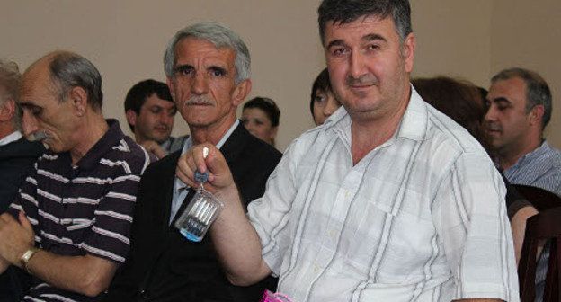 Repatriate from Turkey with keys to a new flat, Abkhazia, Sukhumi, May 30, 2012. Photo by Angela Kuchuberiya for the "Caucasian Knot" Repatriate from Turkey with keys to a new flat, Abkhazia, Sukhumi, May 30, 2012. Photo by Angela Kuchuberiya for the "Caucasian Knot"