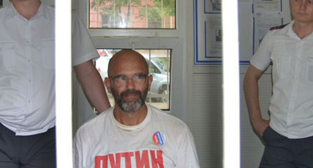 Detained activist Victor Chirikov (center) at a stationary police station in Krasnodar, June 12, 2012. Courtesy of http://vk.com/otkroy_glaza_kuban Detained activist Victor Chirikov (center) at a stationary police station in Krasnodar, June 12, 2012. Courtesy of http://vk.com/otkroy_glaza_kuban
