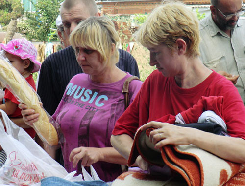 Residents of Krymsk-flood victims receive humanitarian aid, Krasnodar Territory, Krymsk, July 8, 2012. Photo by Natalia Dorokhina for the "Caucasian Knot" Residents of Krymsk-flood victims receive humanitarian aid, Krasnodar Territory, Krymsk, July 8, 2012. Photo by Natalia Dorokhina for the "Caucasian Knot"