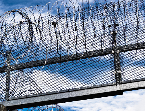 Prison fence. Courtesy of http://www.flickr.com/photos/x1klima/7637108374 Prison fence. Courtesy of http://www.flickr.com/photos/x1klima/7637108374