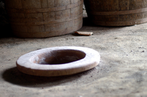 Neck of the traditional vessel named kvevri and used for storing wine is immersed and fixed in the floor, Georgia, Marneuli. Photo: Susan Astray, http://www.flickr.com/photos/susanastray Neck of the traditional vessel named kvevri and used for storing wine is immersed and fixed in the floor, Georgia, Marneuli. Photo: Susan Astray, http://www.flickr.com/photos/susanastray