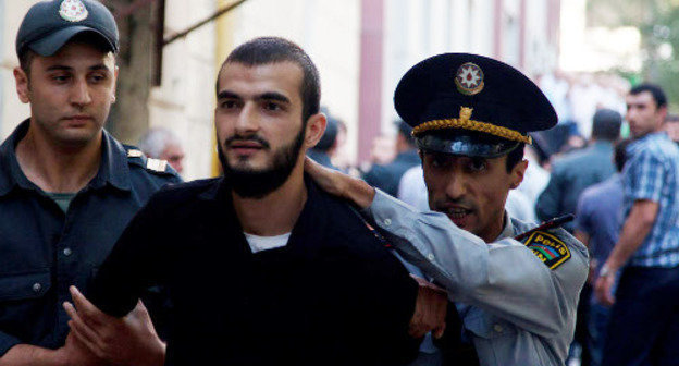 Policemen detaining believer-protester against the ban on wearing hijabs in schools; Azerbaijan, Baku, October 5, 2012. Photo by Aziz Karimov for the "Caucasian Knot" Policemen detaining believer-protester against the ban on wearing hijabs in schools; Azerbaijan, Baku, October 5, 2012. Photo by Aziz Karimov for the "Caucasian Knot"