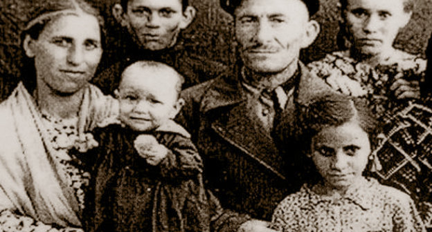 Dalkhat Lokmanovich Kholaev in exile with his family in the Jalalabad Rgion, Kyrgyz SSR. Photo frpm the fund of the Memorial Museum of Repressions and Genocide of Balkar People in 1944-57: http://www.gulagmuseum.org Dalkhat Lokmanovich Kholaev in exile with his family in the Jalalabad Rgion, Kyrgyz SSR. Photo frpm the fund of the Memorial Museum of Repressions and Genocide of Balkar People in 1944-57: http://www.gulagmuseum.org