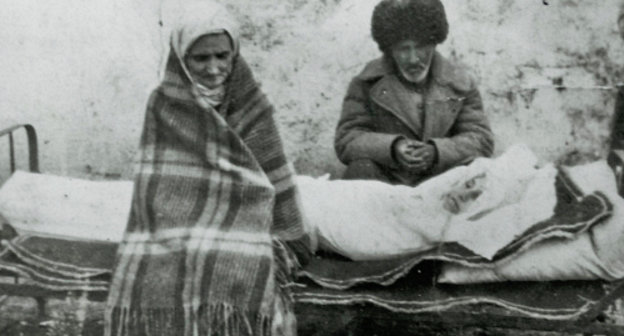 Forced migrants Avdarkhan Cazdiev and his wife Luli Gazdieva (Esieva) with their dead daughter Madina, Kazakhstan, 1946. Photo from http://old.ingushetiyaru.org Forced migrants Avdarkhan Cazdiev and his wife Luli Gazdieva (Esieva) with their dead daughter Madina, Kazakhstan, 1946. Photo from http://old.ingushetiyaru.org