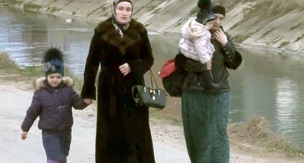 Women and children leave the CTO zone, Makhachkala, township of Semender, March 20, 2013. Still from the video posted on the website of the MIA of Dagestan, http://05.mvd.ru Women and children leave the CTO zone, Makhachkala, township of Semender, March 20, 2013. Still from the video posted on the website of the MIA of Dagestan, http://05.mvd.ru