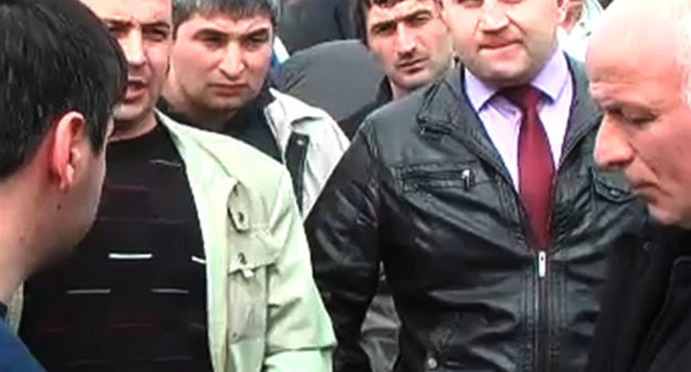 Meeting of "Belaya Rechka" villagers with the requirement to allocate the land plots earlier granted into lease for housing construction; March 16, 2013; still from the video "March 16, 2013; Belaya Rechka (KBR); land defence" by the user debet13 on http://www.youtube.com Meeting of "Belaya Rechka" villagers with the requirement to allocate the land plots earlier granted into lease for housing construction; March 16, 2013; still from the video "March 16, 2013; Belaya Rechka (KBR); land defence" by the user debet13 on http://www.youtube.com