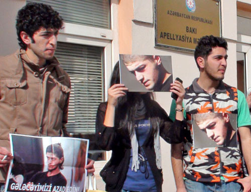Group of young activists holding a silent protest action in front of the AppealCourt by sticking photos of Mamed Azizov to their clothes;Baku, February 27, 2013. Photo by Parvana Bairamova for the "Caucasian Knot" Group of young activists holding a silent protest action in front of the AppealCourt by sticking photos of Mamed Azizov to their clothes;Baku, February 27, 2013. Photo by Parvana Bairamova for the "Caucasian Knot"