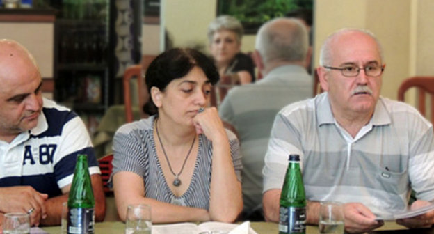 Participants of the project "Strengthening of Women's Capacity for Building Peace in Southern Caucasus" completed by the human rights organization "Centre of Civil Initiatives" in Nagorno-Karabakh. From left to right: the head of the Stepanakert rehabilitation center Vardan Tadevosyan; the chief of the target group in Shushi Anait Tovmasyan;
the head of the "Centre of Civil Initiatives" Albert Voskanyan. Nagorno-Karabakh, Stepanakert, June 29, 2013. Photo by Marta Altunyan, http://www.kavkaz-uzel.ru/blogs/929/posts/15113