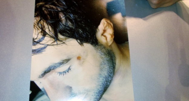 One of the photos of dead Ibragim Todashev, showed at the press conference at RIA-Novosti. Moscow. May 29, 2013. Photo by Karina Gadzhieva for the “Caucasian Knot”. One of the photos of dead Ibragim Todashev, showed at the press conference at RIA-Novosti. Moscow. May 29, 2013. Photo by Karina Gadzhieva for the “Caucasian Knot”.