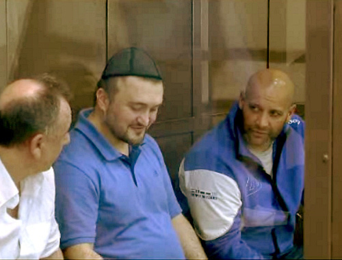 The defendants of the murder case of journalist Anna Politkovskaya Lom-Ali Gaytukaev, Rustam Makhmudov and Sergey Khadjikurbanov before the session. Moscow, June 4, 2013. Screenshot of the footage by the press-cutting service of the Moscow City Court, http://www.mos-gorsud.ru/sud/ The defendants of the murder case of journalist Anna Politkovskaya Lom-Ali Gaytukaev, Rustam Makhmudov and Sergey Khadjikurbanov before the session. Moscow, June 4, 2013. Screenshot of the footage by the press-cutting service of the Moscow City Court, http://www.mos-gorsud.ru/sud/