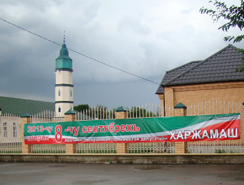 Poster about forthcoming local parliamentary elections of Chechnya of the third convocation on fence of Mosque. July 2013. Photo by the press cutting service of Chechnya election committee, http://www.chechen.izbirkom.ru/ Poster about forthcoming local parliamentary elections of Chechnya of the third convocation on fence of Mosque. July 2013. Photo by the press cutting service of Chechnya election committee, http://www.chechen.izbirkom.ru/