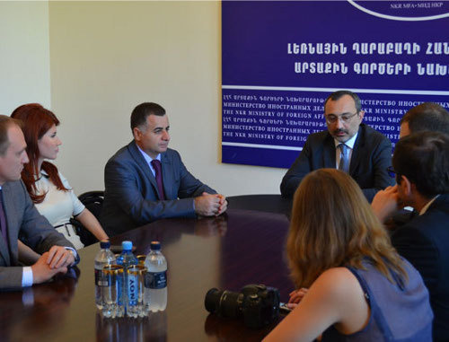 Karen Mirzoyan, Foreign Minister of Nagorno-Karabakh (to the right on the background), receives a group of Russian journalists and public figures who came with visit to Stepanakert. August 28, 2013. Photo http://www.nkr.am/ Karen Mirzoyan, Foreign Minister of Nagorno-Karabakh (to the right on the background), receives a group of Russian journalists and public figures who came with visit to Stepanakert. August 28, 2013. Photo http://www.nkr.am/