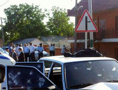 At the car where Akhmed Kotiev was killed. Ingushetia, Malgobek District, Nizhnie Achaluki. August 27, 2013. Photo by press-service of Ingush MIA, 06.mvd.ru At the car where Akhmed Kotiev was killed. Ingushetia, Malgobek District, Nizhnie Achaluki. August 27, 2013. Photo by press-service of Ingush MIA, 06.mvd.ru