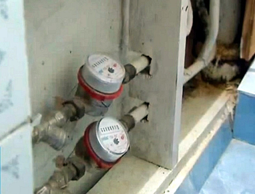House calculating device in a basement of a dwelling house in Cherkessk. Snapshot of a footage by http://stolica-kchr.ru/ House calculating device in a basement of a dwelling house in Cherkessk. Snapshot of a footage by http://stolica-kchr.ru/