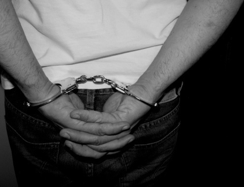 Cuffed hands. Photo: .v1ctor Casale., http://www.flickr.com/photos/v1ctor/ Cuffed hands. Photo: .v1ctor Casale., http://www.flickr.com/photos/v1ctor/