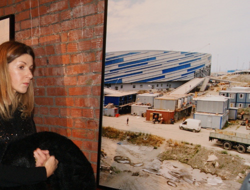 Visitor of the Sochi Project photo exhibition of Dutch authors Rob Hornstra and Arnold van Bruggen, standing at the photo of Olympic palaces under construction. Moscow, October 18, 2013. Photo by Aida Magomedova for the ‘Caucasian Knot’. Visitor of the Sochi Project photo exhibition of Dutch authors Rob Hornstra and Arnold van Bruggen, standing at the photo of Olympic palaces under construction. Moscow, October 18, 2013. Photo by Aida Magomedova for the ‘Caucasian Knot’.