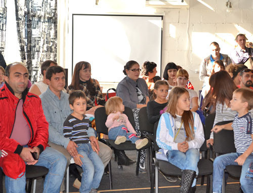 Families with many children gathered in an office building located in Gorky Street to unite and together solve the problem of obtaining land plots. Sochi, October 20, 2013. Photo by Svetlana Kravchenko for the "Caucasian Knot" Families with many children gathered in an office building located in Gorky Street to unite and together solve the problem of obtaining land plots. Sochi, October 20, 2013. Photo by Svetlana Kravchenko for the "Caucasian Knot"