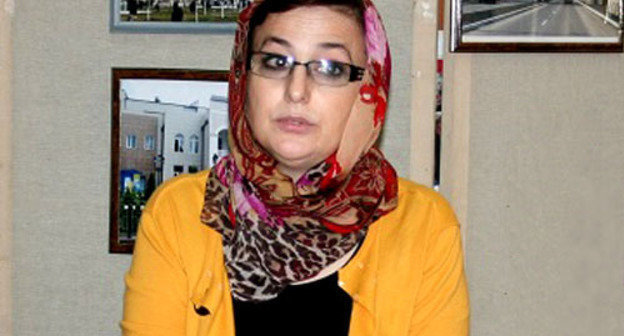 Satsita Israilova, director of the Central City Library. Photo by the Chechen Republic government Committee on Tourism, http://www.chechentourism.ru/ Satsita Israilova, director of the Central City Library. Photo by the Chechen Republic government Committee on Tourism, http://www.chechentourism.ru/