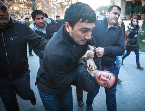 Police detains youth activists at the protest action in Baku on December 29, 2013. Photo by Aziz Karimov for the "Caucasian Knot" Police detains youth activists at the protest action in Baku on December 29, 2013. Photo by Aziz Karimov for the "Caucasian Knot"
