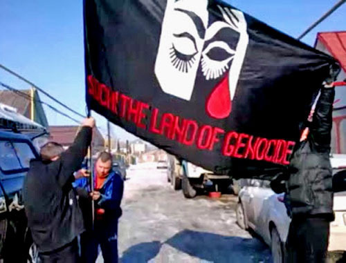 Flag of the rally against Sochi Olympics, Nalchik, February 7, 2014. Screenshot from video http://bambuser.com/ Flag of the rally against Sochi Olympics, Nalchik, February 7, 2014. Screenshot from video http://bambuser.com/
