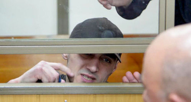 Convicted Yusup Dzangiev talks to his father in the courtroom in the North-Caucasian District Military Court. Rostov-on-Don, April 8, 2014. Photo by Oleg Pchelov for the "Caucasian Knot" Convicted Yusup Dzangiev talks to his father in the courtroom in the North-Caucasian District Military Court. Rostov-on-Don, April 8, 2014. Photo by Oleg Pchelov for the "Caucasian Knot"