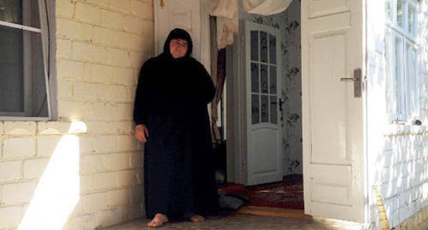 The village of Maidanskoe, Untsukul District of Dagestan, July 2014. Ayna Gamzatova, mother of the villager Magomed Payzulaev killed during the special operation on July 6, 2014, in the door of her house. Photo by Makhach Akhmedov for the "Caucasian Knot" The village of Maidanskoe, Untsukul District of Dagestan, July 2014. Ayna Gamzatova, mother of the villager Magomed Payzulaev killed during the special operation on July 6, 2014, in the door of her house. Photo by Makhach Akhmedov for the "Caucasian Knot"