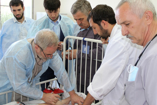 Chief anaesthesiologist-physician of Russia’s Ministry of Health Valery Amcheslavsky (to the left) examining 4-year-old Markha Yusupova. Photo: http://www.grozny-inform.ru/main.mhtlm?Part=12&PubID=53163 Chief anaesthesiologist-physician of Russia’s Ministry of Health Valery Amcheslavsky (to the left) examining 4-year-old Markha Yusupova. Photo: http://www.grozny-inform.ru/main.mhtlm?Part=12&PubID=53163