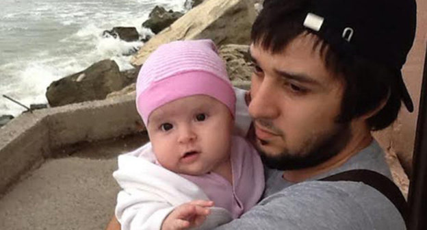 Kamil Guliev with his baby. Photo provided by Guliev’s wife from the family archive. Kamil Guliev with his baby. Photo provided by Guliev’s wife from the family archive.
