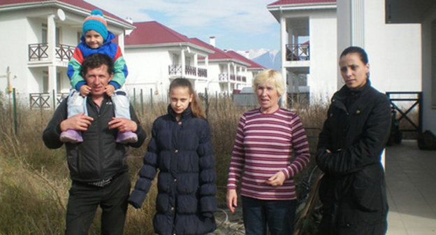 The Saveliev family at their new 'home'. Photo by Alexei Saveliev