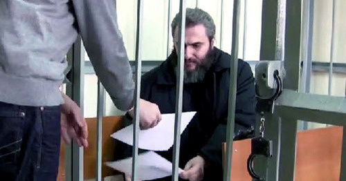 Boris Stomakhin in the courtroom. Screenshot of a video by the user sevikazia http://www.youtube.com/" Boris Stomakhin in the courtroom. Screenshot of a video by the user sevikazia http://www.youtube.com/"