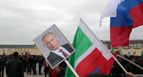 Vladimir Putin’s portrait and flags of Russia and Chechnya, Grozny, March 2015. Photo by Akhmed Aldebirov for the ‘Caucasian Knot’. Vladimir Putin’s portrait and flags of Russia and Chechnya, Grozny, March 2015. Photo by Akhmed Aldebirov for the ‘Caucasian Knot’.
