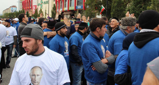 Young men at the rally on Putin's birthday in Grozny. Photo by Magomed Magomedov for the "Caucasian Knot"