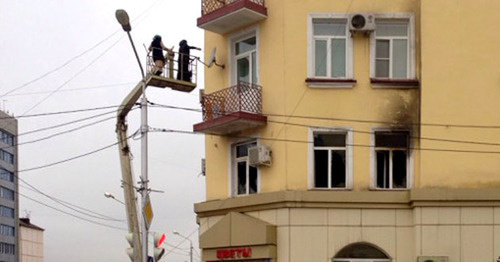 The fire in the flat where the office of the Joint Mobile Group (JMG) is located. Grozny, December 15, 2014. Photo by Akhmed Aldebirov for the "Caucasian Knot" The fire in the flat where the office of the Joint Mobile Group (JMG) is located. Grozny, December 15, 2014. Photo by Akhmed Aldebirov for the "Caucasian Knot"