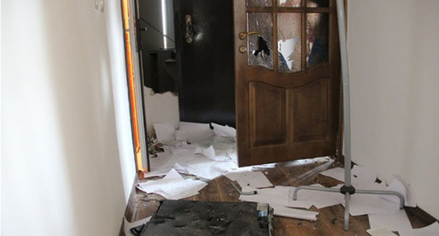 Broken door and scattered documents in the Committee against Torture office in Grozny, June 3, 2015. Broken door and scattered documents in the Committee against Torture office in Grozny, June 3, 2015.