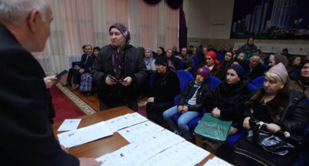Giving out "genetic passports" to the relatives of the kidnapped residents of Chechnya. Grozny, March 2015. Photo by Kazbek Vakhaev http://www.grozny-inform.ru/news/society/58610/