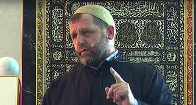 Khamzat Chumakov. Screenshot from the video of Khamzat Chumakov’s sermon (Khutba, July 31, 2015), http://ingislam.ru/video/homilies/homily_442.html Khamzat Chumakov. Screenshot from the video of Khamzat Chumakov’s sermon (Khutba, July 31, 2015), http://ingislam.ru/video/homilies/homily_442.html