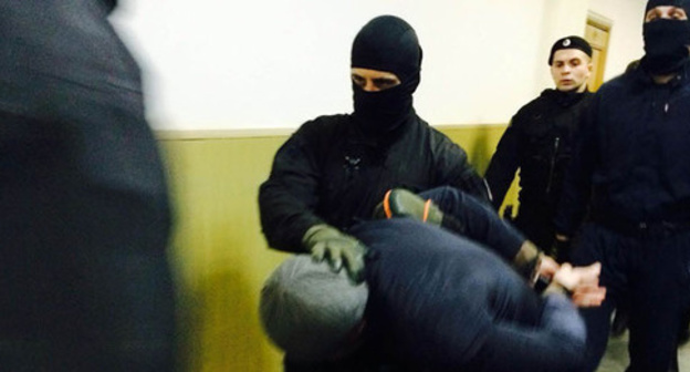 The defendant Anzor Gubashev is led  to the courtroom. Moscow, March 2015. Photo by the "Caucasian Knot" correspondent