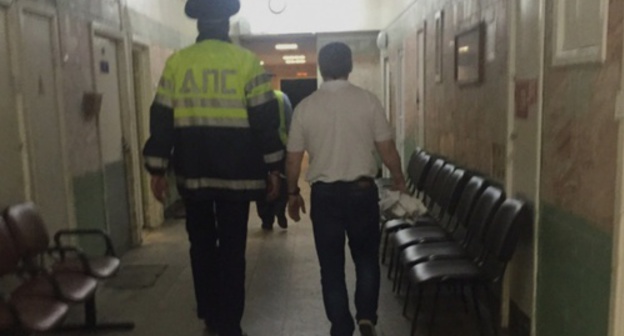 Khadjimurat Temurziev is led to the courtroom. Moscow, August 28, 2015. Photo by Mikail Kostoev for the "Caucasian Knot" Khadjimurat Temurziev is led to the courtroom. Moscow, August 28, 2015. Photo by Mikail Kostoev for the "Caucasian Knot"