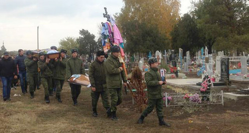 Burial of Vadim Kostenko. Photo: Sergey Khazov-Kassiya, RFE/ RL, http://www.svoboda.org/content/article/27332224.html Burial of Vadim Kostenko. Photo: Sergey Khazov-Kassiya, RFE/ RL, http://www.svoboda.org/content/article/27332224.html