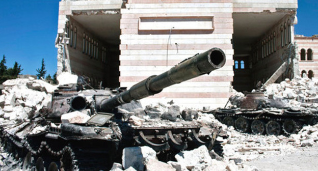 Shot-up tanks against a mosque in the Syrian town of Azaz. August 2012. Photo by the user Christiaan Triebert https://www.flickr.com Shot-up tanks against a mosque in the Syrian town of Azaz. August 2012. Photo by the user Christiaan Triebert https://www.flickr.com