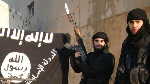 IS supporters near the "Islamic State" flag (Islamic State is a terrorist organization banned in Russia). Photo by user Vesti Detalno, www.flickr.com