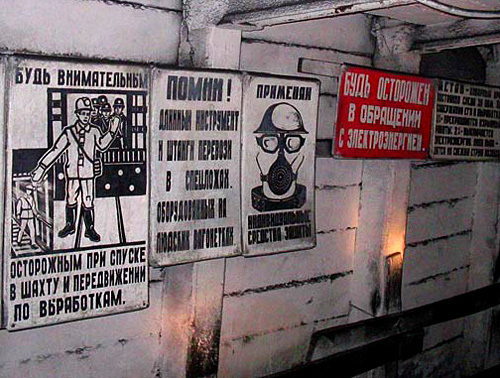 Rostov Region, Gukovo. At descend into the 50 Years of October mine. Poster on the left: "Be attentive and careful at descending into the mine!" Photo by www.gukovo.ru Rostov Region, Gukovo. At descend into the 50 Years of October mine. Poster on the left: "Be attentive and careful at descending into the mine!" Photo by www.gukovo.ru
