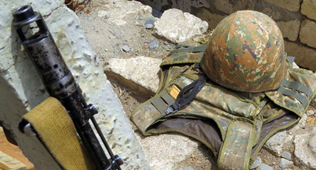 A casket, bullet-proof vest and firearms of an NKR's army soldier. Photo by Alvard Grigoryan for the "Caucasian Knot"