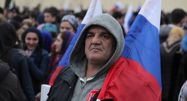 A participant of the rally in Grozny, March 2015. Photo by Akhmed Aldebirov for the "Caucasian Knot" A participant of the rally in Grozny, March 2015. Photo by Akhmed Aldebirov for the "Caucasian Knot"